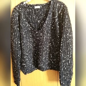 Sweater, a bit cropped, comes to belly, below hip